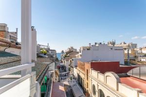 Nespecifikovaný výhled na destinaci Sitges nebo výhled na město při pohledu z apartmánu