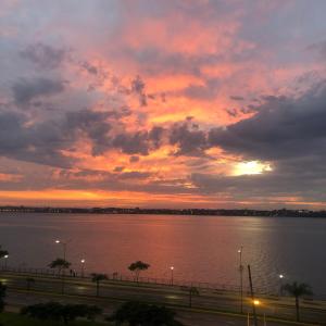 a sunset over a large body of water at Edificio Itasu - 4to - alquileres temporales in Posadas