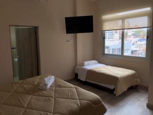Edificio Itasu - 4to - alquileres temporales客房内的一张或多张床位