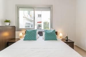 Postel nebo postele na pokoji v ubytování Fragata Sitges Rentals