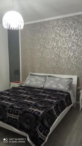 Cama ou camas em um quarto em Sweet Home QSE