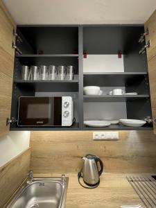 Kuchyň nebo kuchyňský kout v ubytování Smart Apartment l