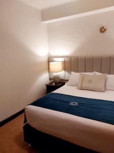 Cama ou camas em um quarto em Katari at Plaza de Armas Cusco