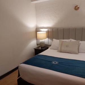 Cama ou camas em um quarto em Katari at Plaza de Armas Cusco