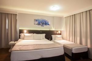 Cama ou camas em um quarto em Hotel WZ Jardins