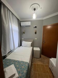 Postel nebo postele na pokoji v ubytování GRAND Deniz Hotel