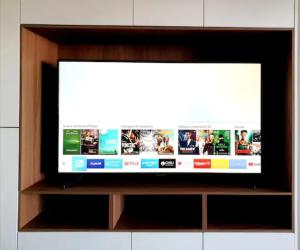 a flat screen tv sitting on a shelf at Terrace Civitanova Life in Civitanova Marche