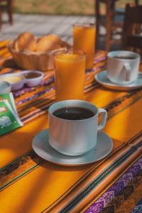 a table with a cup of coffee on a table at EL MANÁ in Huarmey +14 photos