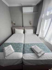 Postel nebo postele na pokoji v ubytování GRAND Deniz Hotel