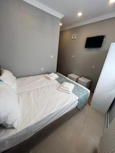 Postel nebo postele na pokoji v ubytování GRAND Deniz Hotel