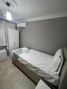 Postel nebo postele na pokoji v ubytování GRAND Deniz Hotel