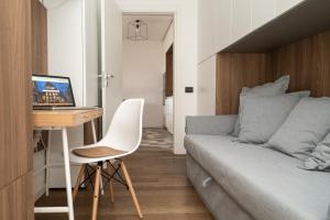 a bedroom with a bed and a desk with a computer at Terrace Civitanova Life in Civitanova Marche +38 photos