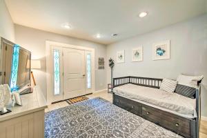 a bedroom with a bed and a window at Cozy Northville Home with Dock, Lake Access and Views! in Benson