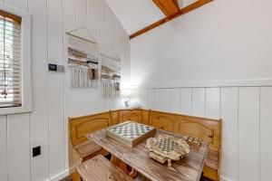 a dining room with a wooden table in a room at Double View Lodge in Idyllwild