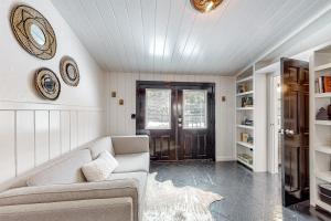 a living room with a couch and a door at Double View Lodge in Idyllwild
