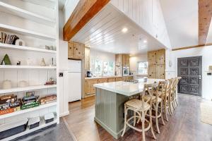 a kitchen with a large island with bar stools at Double View Lodge in Idyllwild