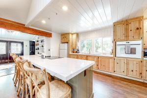a kitchen with wooden cabinets and a white counter top at Double View Lodge in Idyllwild +19 photos