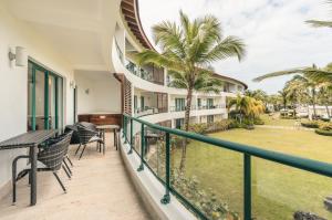 a balcony with a view of a resort at Go away to this charming apt at Sublime w private jacuzzi included in Las Terrenas