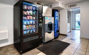 a large soda vending machine in a room at Motel 6-Bakersfield, CA - South in Bakersfield