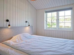 Lova arba lovos apgyvendinimo įstaigoje Holiday home Rønne XI