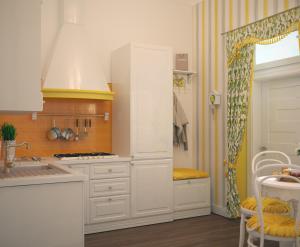 利維夫的住宿－Edem Apartmants in Lviv 2，厨房配有白色橱柜和水槽