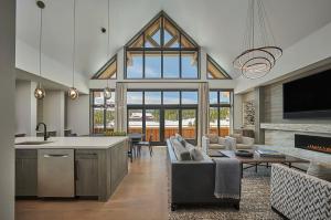 a large kitchen and living room with a large window at Montage Big Sky in Big Sky