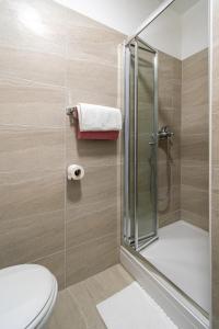 a bathroom with a shower and a toilet at Double Room Pasman 4309d in Pašman