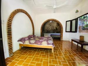 Postel nebo postele na pokoji v ubytování HABITACIONES EN VALLARTA 6 CUADRAS MALECON