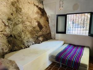 Postel nebo postele na pokoji v ubytování HABITACIONES EN VALLARTA 6 CUADRAS MALECON
