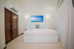 Letto o letti in una camera di Paradise Beach Hotel & Resort