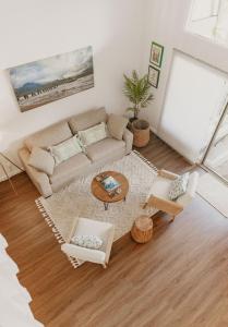 a living room with a couch and a table at Puamana Maluhia - Two Bedroom / Two Bath Condo in Princeville