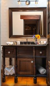 a bathroom with a sink and a mirror at Hotel Boutique Casa Colorada in Pátzcuaro