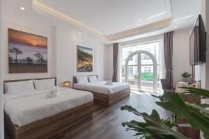 Postel nebo postele na pokoji v ubytování MSing DaLat Hotel