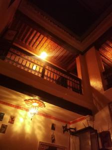 a building with a ceiling with a light on it at Hostel Kech Vibe in Marrakech