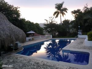 Bazén v ubytování Hostal finca Palermo nebo v jeho okolí
