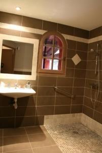 a bathroom with a sink and a shower at l'Hotellerie Kouros in Cuers +23 photos