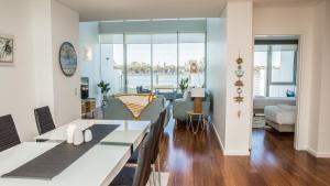 a living room with a dining table and a living room at Bridgepoint 103 in Mandurah