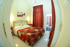 Tempat tidur dalam kamar di Bed & Breakfast Casalino