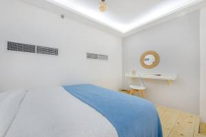 Postel nebo postele na pokoji v ubytování Homely loft with great facilities by Suiteable