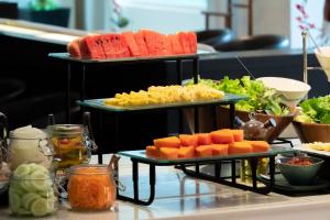 two plates of fruit and vegetables on a table at NH Bangkok Asoke in Bangkok +38 photos