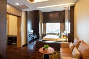 Postel nebo postele na pokoji v ubytování Jasmine Resort Bangkok