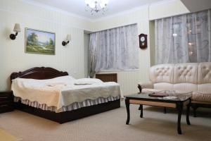 Postel nebo postele na pokoji v ubytování Hotel Botakoz + 27 fotografií