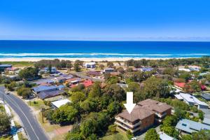 an aerial view of a suburb with a house and the ocean at Hopeview Haven 5 in Dunbogan +5 photos