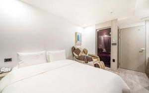 Voodi või voodid majutusasutuse Ocean city hotel toas