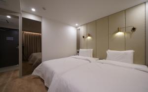 Voodi või voodid majutusasutuse Ocean city hotel toas