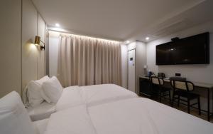 Voodi või voodid majutusasutuse Ocean city hotel toas