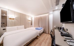 TV a/nebo společenská místnost v ubytování Ocean city hotel