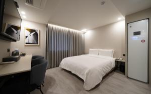 Voodi või voodid majutusasutuse Ocean city hotel toas
