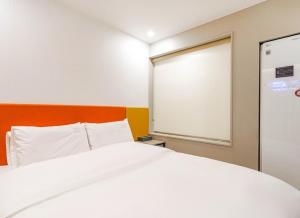 Voodi või voodid majutusasutuse Ocean city hotel toas