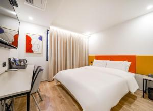 Voodi või voodid majutusasutuse Ocean city hotel toas